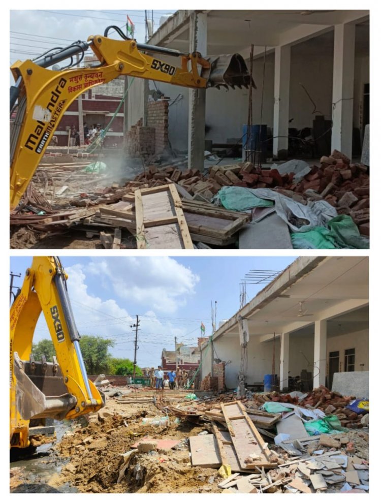 Mathura: वृंदावन विकास प्राधिकरण ने लिया एक्शन, अवैध दुकानों पर चलाया बुलडोजर